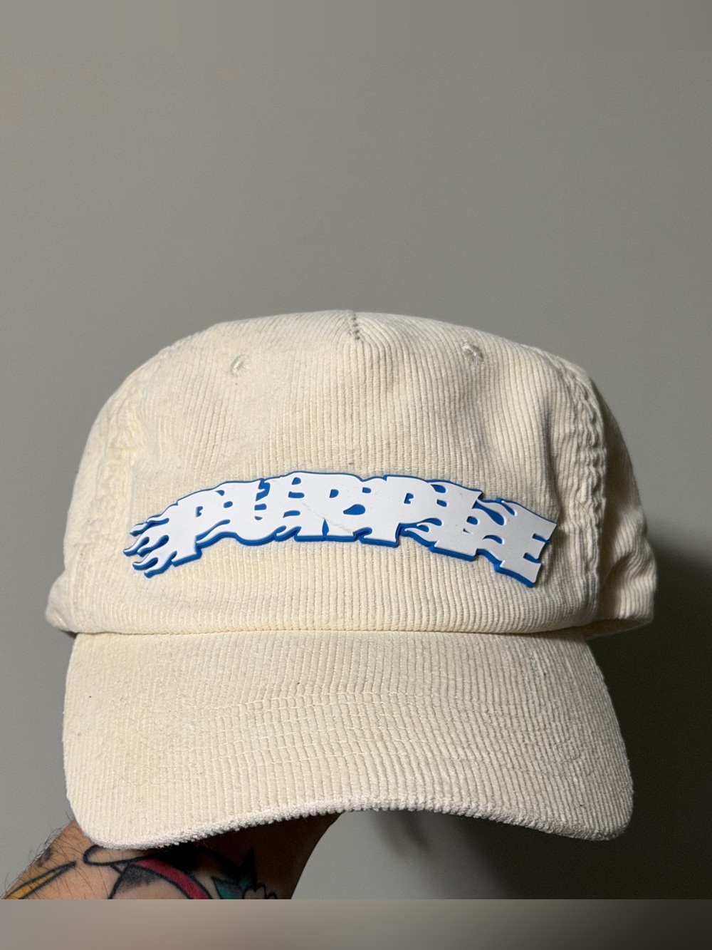 Purple Brand Cream corduroy baseball cap with blue flame logo